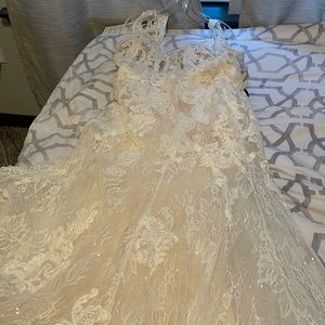 New wedding gown. With tags. Never worn before.